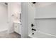 Bright bathroom featuring white subway tile and modern fixtures at 17868 W Blue Sky Dr, Surprise, AZ 85387