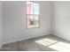 Bedroom with gray wood-look tile flooring at 17868 W Blue Sky Dr, Surprise, AZ 85387