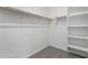 Walk-in closet with multiple shelves and rods for ample storage at 17868 W Blue Sky Dr, Surprise, AZ 85387