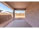 Covered patio overlooking backyard at 17868 W Blue Sky Dr, Surprise, AZ 85387