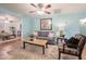 Living room with hardwood floors, featuring a comfy couch and coffee table at 2021 W Osborn Rd, Phoenix, AZ 85015