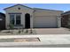 New single-story home with a two-car garage and desert landscaping at 22811 E Stacey Rd, Queen Creek, AZ 85142