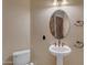 Small bathroom with pedestal sink and toilet at 2322 E Samantha Way, Phoenix, AZ 85042