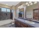 Bathroom with shower, tile flooring, and wood vanity at 2322 E Samantha Way, Phoenix, AZ 85042