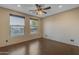 Bedroom with hardwood floors and two windows at 2322 E Samantha Way, Phoenix, AZ 85042