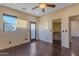 Bright bedroom with wood floors, private balcony access, and walk-in closet at 2322 E Samantha Way, Phoenix, AZ 85042