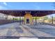 Covered patio with fireplace and picnic tables at 2322 E Samantha Way, Phoenix, AZ 85042