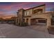 Two-story home with stone accents and a covered garage at 2322 E Samantha Way, Phoenix, AZ 85042