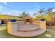 Circular fire pit with brick flooring and seating at 2322 E Samantha Way, Phoenix, AZ 85042