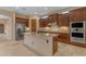 Modern kitchen with wood cabinetry and granite countertops at 2322 E Samantha Way, Phoenix, AZ 85042