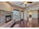 Living room with corner fireplace and access to private balcony at 2322 E Samantha Way, Phoenix, AZ 85042