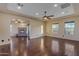 Spacious living room featuring hardwood floors, a fireplace, and large windows at 2322 E Samantha Way, Phoenix, AZ 85042