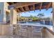 Inviting pool area with built-in bar and mountain views at 2322 E Samantha Way, Phoenix, AZ 85042