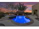 Blue illuminated pool with a spa and a covered bar at 2322 E Samantha Way, Phoenix, AZ 85042