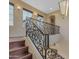 Upper staircase with wrought iron railing at 2322 E Samantha Way, Phoenix, AZ 85042