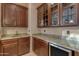 Wet bar with granite countertop and wine cooler at 2322 E Samantha Way, Phoenix, AZ 85042