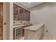 Wet bar featuring granite countertops and ample cabinetry at 2322 E Samantha Way, Phoenix, AZ 85042