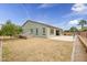 Landscaped backyard with grassy area and fruit tree at 2749 E Pearl St, Mesa, AZ 85213