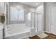 Elegant bathroom with soaking tub, walk-in shower, and modern fixtures at 2749 E Pearl St, Mesa, AZ 85213