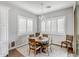 Charming dining room with a round table, four chairs, and a chandelier at 2749 E Pearl St, Mesa, AZ 85213