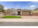 Single-story home with stone accents and a two-car garage at 2749 E Pearl St, Mesa, AZ 85213