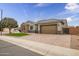 House exterior with two-car garage and landscaped yard at 2749 E Pearl St, Mesa, AZ 85213