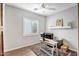 Bright home office with desk, window, and wood door at 2749 E Pearl St, Mesa, AZ 85213