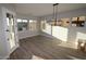 Bright dining area with a modern light fixture and many windows offering scenic views at 32521 N 135Th Dr, Peoria, AZ 85383