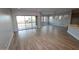 Spacious living room featuring neutral walls, tile flooring, and sliding doors for natural light at 32521 N 135Th Dr, Peoria, AZ 85383