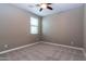 Bright bedroom with ceiling fan and window blinds at 3943 E Canyon Pl, Chandler, AZ 85249