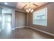 Spacious dining room featuring wood-look floors and large window at 3943 E Canyon Pl, Chandler, AZ 85249