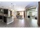 Open concept kitchen and dining area with granite island and modern cabinetry at 3943 E Canyon Pl, Chandler, AZ 85249