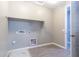 Laundry room with built-in shelving and a utility sink at 3943 E Canyon Pl, Chandler, AZ 85249