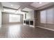 Living room with fireplace and built-in shelving at 3943 E Canyon Pl, Chandler, AZ 85249