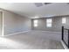 Large loft area with carpet and multiple windows at 3943 E Canyon Pl, Chandler, AZ 85249