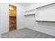 Bright walk-in closet with built-in shelving and laundry area access at 3943 E Canyon Pl, Chandler, AZ 85249