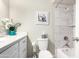 Bright bathroom featuring updated shower with marble tile, vanity with white countertop, and modern fixtures at 4329 W Sierra St, Glendale, AZ 85304