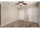 Cozy bedroom with a ceiling fan and sliding closet doors at 4329 W Sierra St, Glendale, AZ 85304