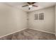 Bedroom with a ceiling fan, open shelving and a bright window at 4329 W Sierra St, Glendale, AZ 85304