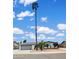 Single-story home with a desert-style front yard featuring a tall palm tree and a two-car garage at 4329 W Sierra St, Glendale, AZ 85304