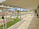 Covered patio with decorative swing overlooking a backyard pool, perfect for outdoor relaxation and entertainment at 4329 W Sierra St, Glendale, AZ 85304