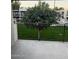 Private balcony with a view of a lush green courtyard and a tree at 4635 N 22Nd St # 212, Phoenix, AZ 85016