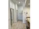 Bright bathroom with a long granite vanity, decorative tile flooring and walk-in closet at 7143 E Canyon Wren Dr, Gold Canyon, AZ 85118