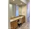 Bathroom boasts double sinks, granite countertops, a tile floor, and framed mirrors at 7143 E Canyon Wren Dr, Gold Canyon, AZ 85118