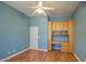 Inviting bedroom features a ceiling fan, and a built-in desk, perfect for working from home at 7143 E Canyon Wren Dr, Gold Canyon, AZ 85118