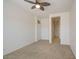 Bedroom featuring neutral carpet, ceiling fan, and ample natural light at 7143 E Canyon Wren Dr, Gold Canyon, AZ 85118