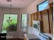 Functional kitchen features wood cabinets, modern appliances, and bright windows at 7143 E Canyon Wren Dr, Gold Canyon, AZ 85118