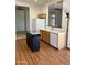 Kitchen featuring wood floors, white appliances, an island, and views of other rooms at 7143 E Canyon Wren Dr, Gold Canyon, AZ 85118