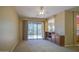 Cozy living room with sliding glass doors that open to an outdoor living space at 7143 E Canyon Wren Dr, Gold Canyon, AZ 85118