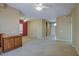 Spacious living room featuring neutral carpet, ceiling fan, and open floor plan at 7143 E Canyon Wren Dr, Gold Canyon, AZ 85118